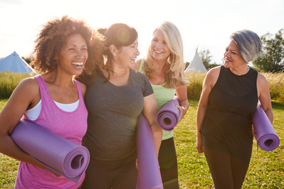 group of women with yoga mats